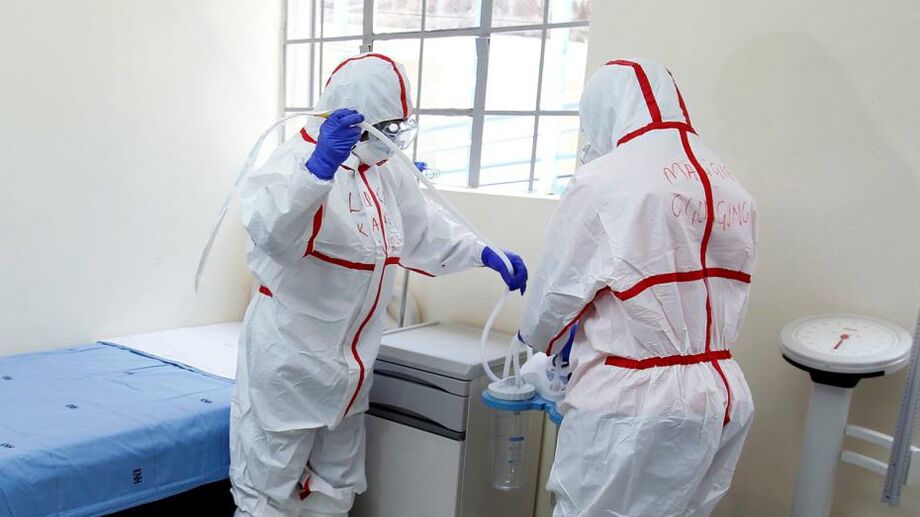 Kenyan nurses wearing protective gear prepare a ward during a demonstration of preparations for any potential coronavirus cases at the Mbagathi Hospital, isolation centre for coronavirus, in Nairobi