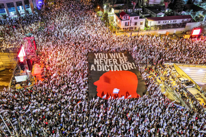 An aerial view shows protesters taking part in a demonstration against Israeli Prime Minister Benjamin Netanyahu and his nationalist coalition government’s judicial overhaul, in Tel Aviv
