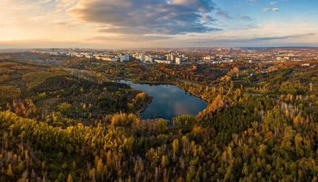 aerial-view-of-a-lake-in-a-park-with-autumn-trees-kishinev-moldova-epic-aerial-flight-over-water-colorful-autumn-trees-in-the-daytime_230497-2580